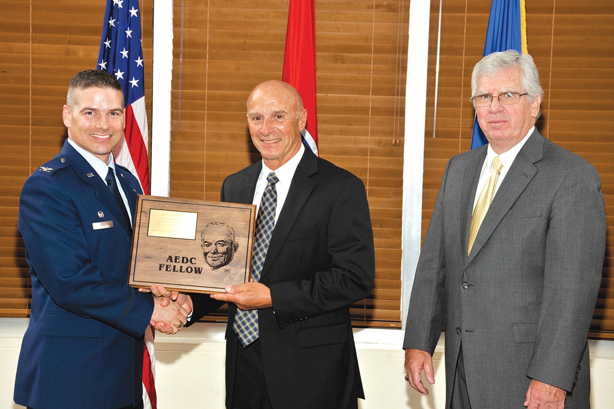 Ron Polce (center) receives the AEDC Lifetime Achievement Fellow award from AEDC Commander Col. Raymond Toth (left) and AEDC Chief Scientist Dr. Ed Kraft. (Photo by Rick Goodfriend)