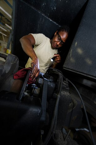 Senior Airman Constance Every, 560th Red Horse Squadron vehicle maintenance technician, cleans brake dust from a vehicle June 25, 2013, at Joint Base Charleston – Air Base, S.C. Vehicle maintenance technicians maintain JB Charleston's entire vehicle fleet, keeping cars, trucks and buses operating smoothly. (U.S. Air Force photo/ Senior Airman George Goslin)