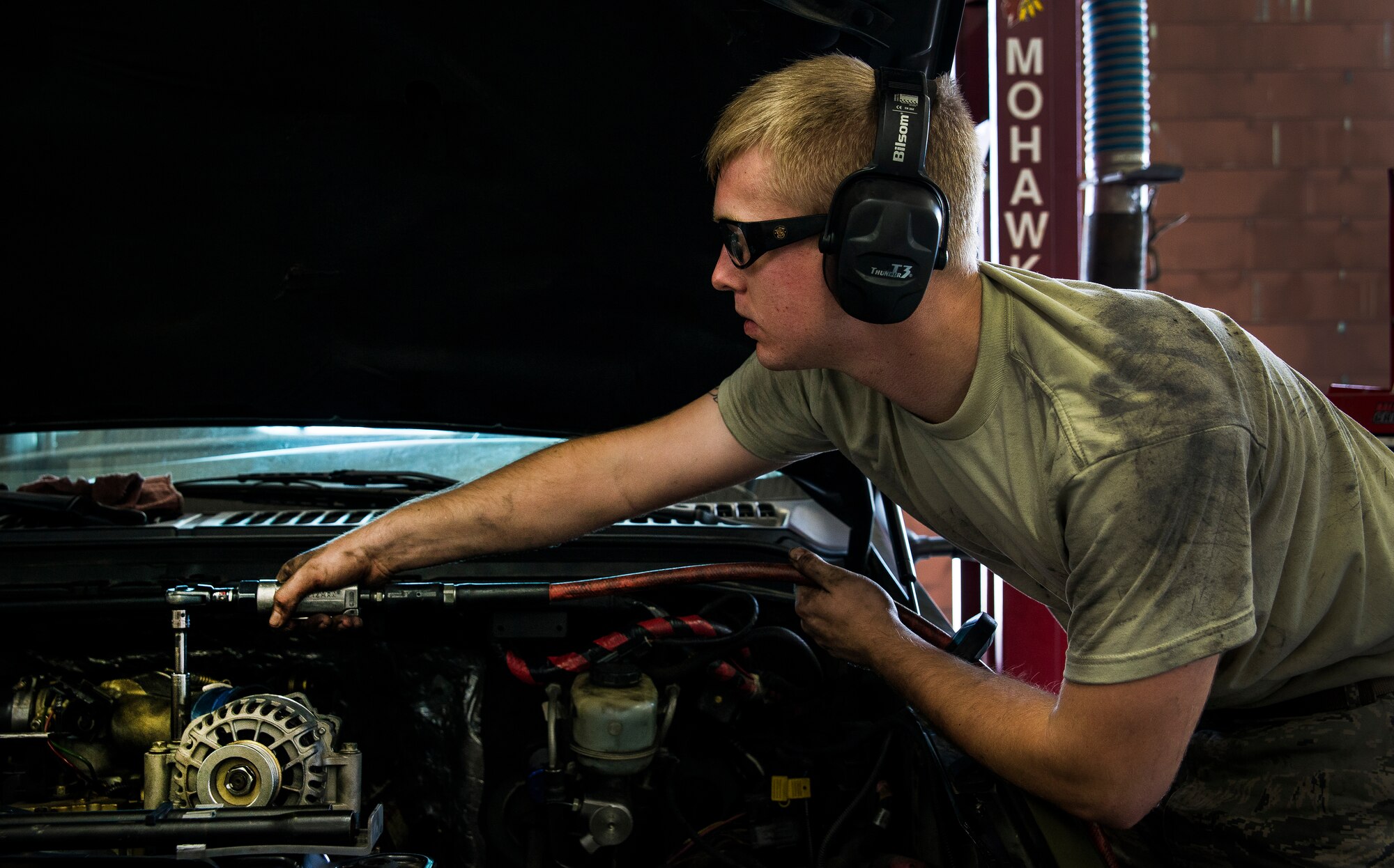 Senior Airman Matthew Fincher, 628th Logistics Readiness Squadron vehicle maintenance technician, torques a bolt in a truck June 25, 2013, at Joint Base Charleston – Air Base, S.C. Vehicle maintenance technicians maintain JB Charleston's entire vehicle fleet, keeping cars, trucks and buses operating smoothly. (U.S. Air Force photo/ Senior Airman George Goslin)
