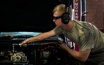 Senior Airman Matthew Fincher, 628th Logistics Readiness Squadron vehicle maintenance technician, torques a bolt in a truck June 25, 2013, at Joint Base Charleston – Air Base, S.C. Vehicle maintenance technicians maintain JB Charleston's entire vehicle fleet, keeping cars, trucks and buses operating smoothly. (U.S. Air Force photo/ Senior Airman George Goslin)