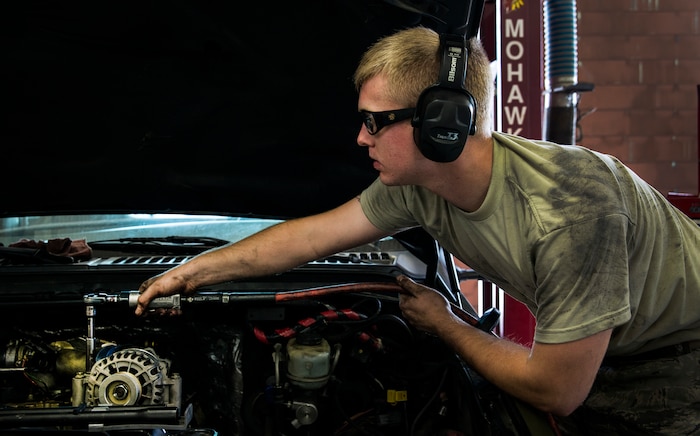 Senior Airman Matthew Fincher, 628th Logistics Readiness Squadron vehicle maintenance technician, torques a bolt in a truck June 25, 2013, at Joint Base Charleston – Air Base, S.C. Vehicle maintenance technicians maintain JB Charleston's entire vehicle fleet, keeping cars, trucks and buses operating smoothly. (U.S. Air Force photo/ Senior Airman George Goslin)