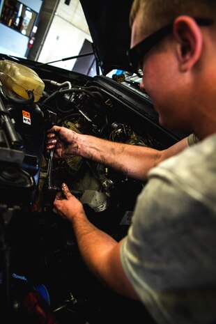 Senior Airman Matthew Fincher, 628th Logistics Readiness Squadron vehicle maintenance technician, torques a bolt in a truck June 25, 2013, at Joint Base Charleston – Air Base, S.C. Vehicle maintenance technicians maintain JB Charleston's entire vehicle fleet, keeping cars, trucks and buses operating smoothly. (U.S. Air Force photo/ Senior Airman George Goslin)