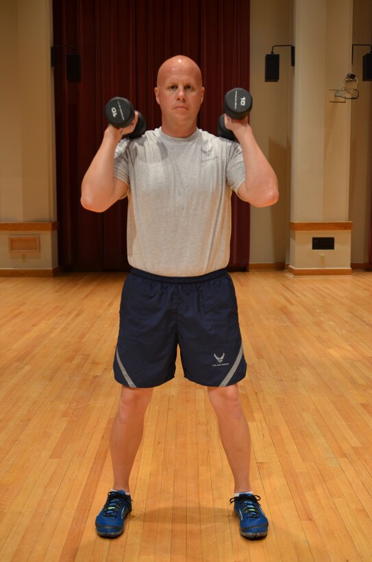 Master Sergeant demonstrates the "Pres Up" mid position. (A.F. Photo)