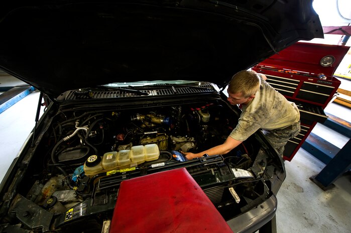 Senior Airman Matthew Fincher, 628th Logistics Readiness Squadron vehicle maintenance technician, installs a part in a truck June 25, 2013, at Joint Base Charleston – Air Base, S.C. Vehicle maintenance technicians maintain JB Charleston's entire vehicle fleet, keeping cars, trucks and buses operating smoothly. (U.S. Air Force photo/ Senior Airman George Goslin)