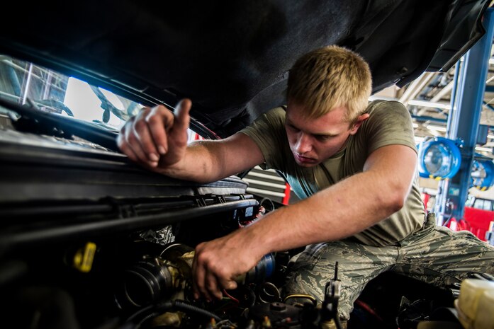 Senior Airman Matthew Fincher, 628th Logistics Readiness Squadron vehicle maintenance technician, installs a part in a truck June 25, 2013, at Joint Base Charleston – Air Base, S.C. Vehicle maintenance technicians maintain JB Charleston's entire vehicle fleet, keeping cars, trucks and buses operating smoothly. (U.S. Air Force photo/ Senior Airman George Goslin)