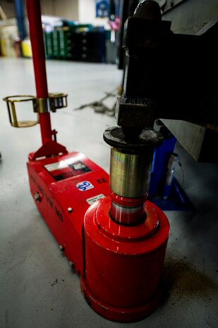 A 44-ton capacity air operated hydraulic floor jack holds up the side of a vehicle for brake maintenance June 25, 2013, at Joint Base Charleston – Air Base, S.C. Vehicle maintenance technicians maintain JB Charleston's entire vehicle fleet, keeping cars, trucks and buses operating smoothly. (U.S. Air Force photo/ Senior Airman George Goslin)