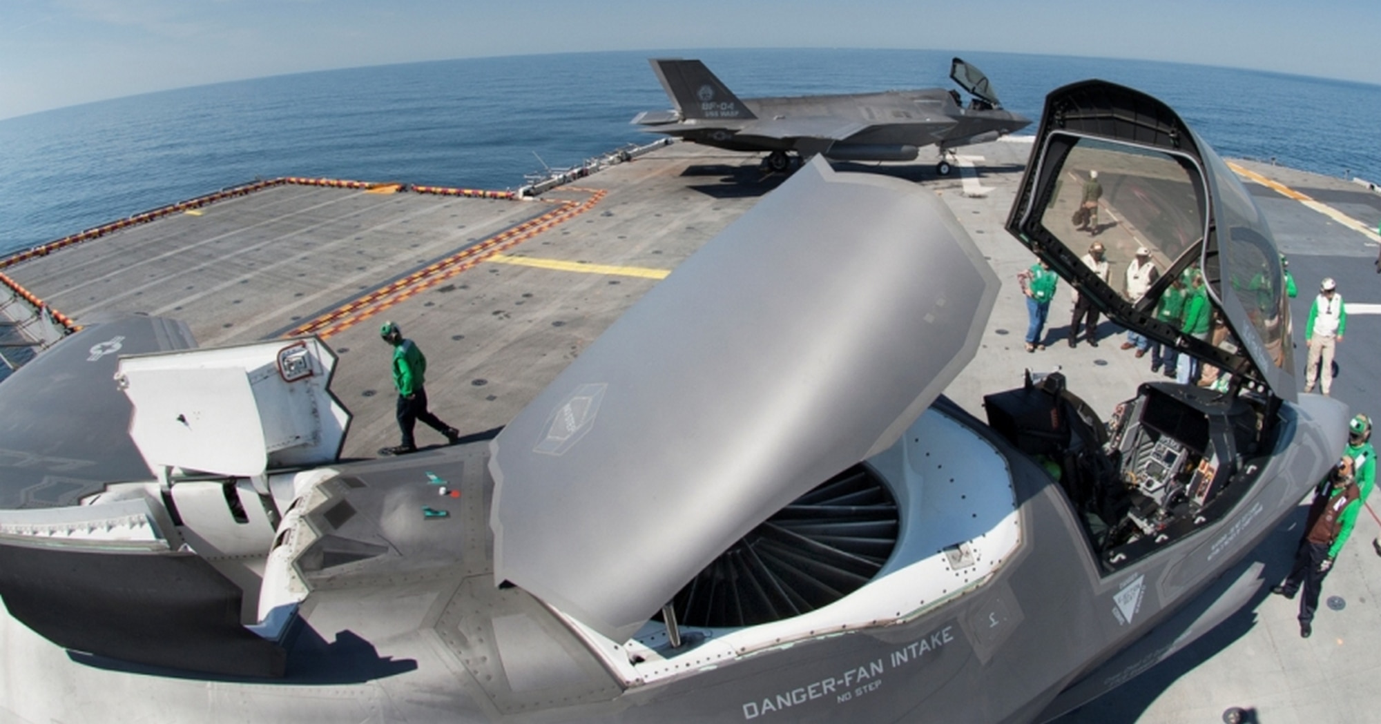 This view of the F-35 Lightning II Joint Strike Fighter shows the lift fan (center) beneath the “57 Chevy Hood” door. This door replaced the bi-fold doors which generated a pressure distortion pattern causing vibrations on the fan blades. (Photo by Lockheed Martin)