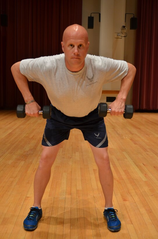 Master Sergeant Carson demonstrates the "Back Row" finish position. (A.F. Photo)