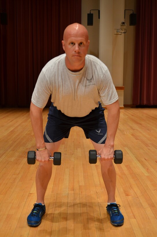 Master Sergeant Carson demonstrates the "Back Row" start position. (A.F. Photo)