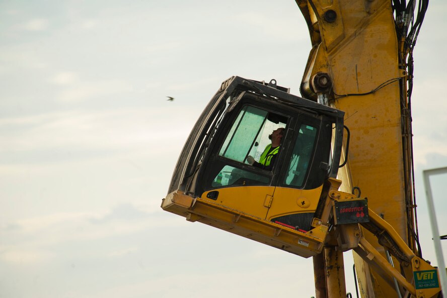 The old air control tower goes through the demolition process at Minot Air Force Base, N.D., June 21, 2013. The new tower is built adjacent to the old tower on the south side of the runway. The old tower went into service Jan. 1, 1966. (U.S. Air Force photos/Senior Airman Brittany Y. Auld)

