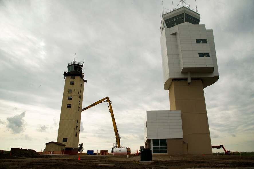 The old air control tower goes through the demolition process at Minot Air Force Base, N.D., June 21, 2013. The new tower is built adjacent to the old tower on the south side of the runway. The old tower went into service Jan. 1, 1966. (U.S. Air Force photos/Senior Airman Brittany Y. Auld)


