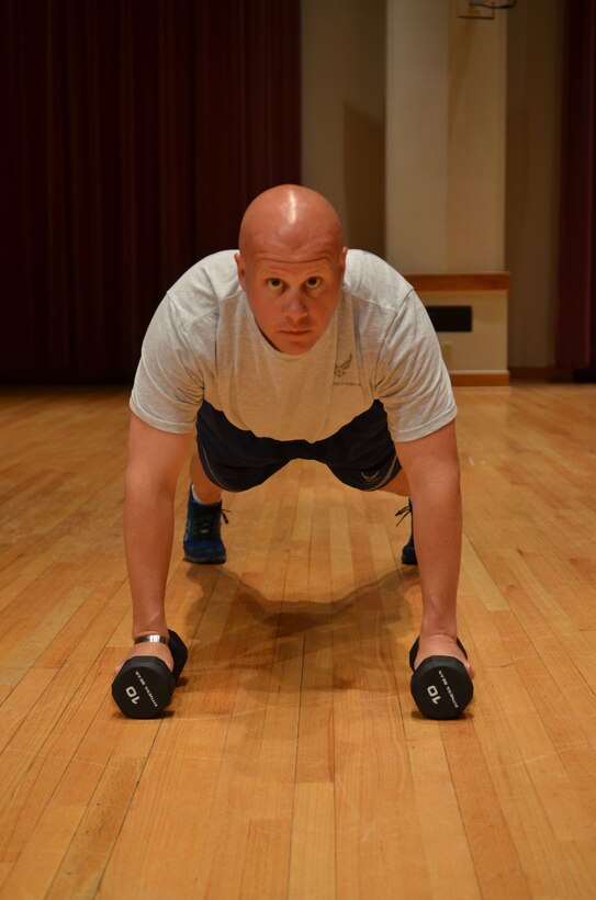 Master Sergeant Carson demonstrates the "Man Maker" mid position. (A.F. Photo)