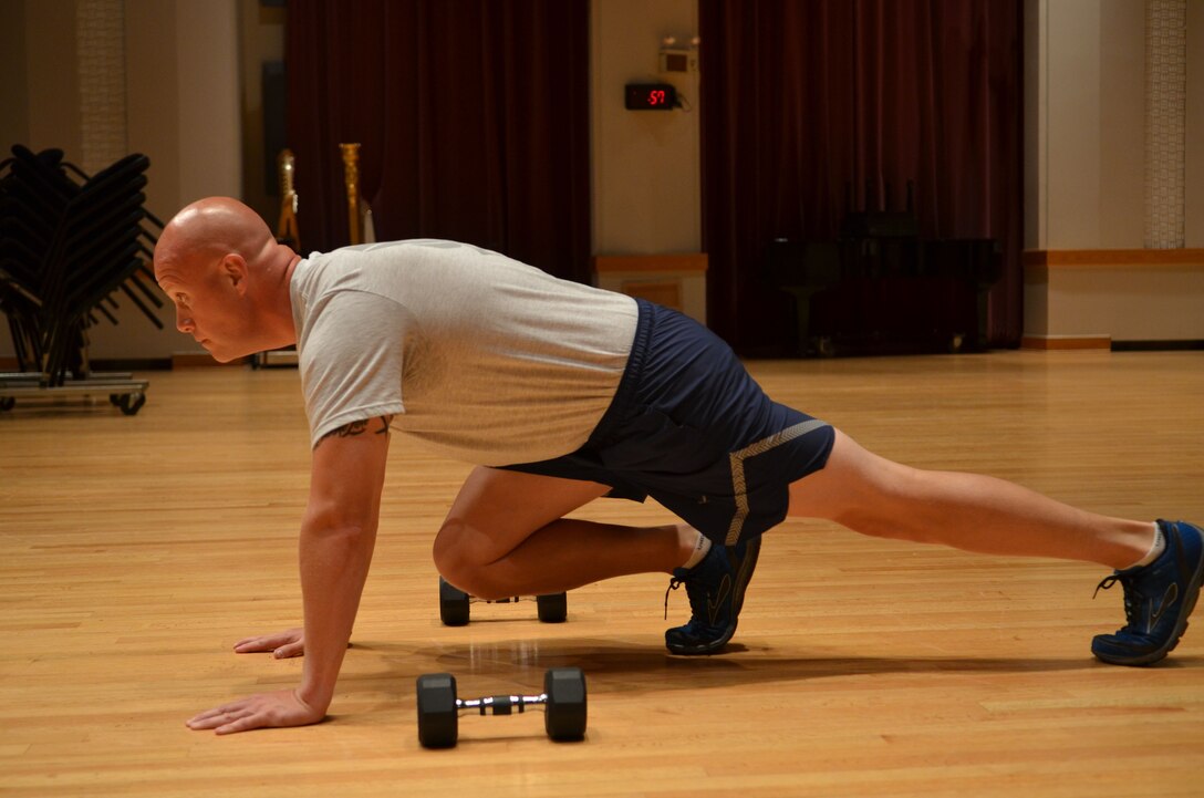 Master Sergeant Carson demonstrates the "Mountain Climber" right position. (A.F. Photo)
