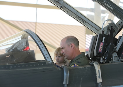 Col. David Drichta, 12th Operations Group deputy commander, shows his daughter, Allison, the cockpit of the T-38C Talon, following his first flight back after his battle with cancer at Joint Base San Antonio-Randolph, Texas June 19, 2013.  Drichta was diagnosed with Stage IV cancer in February 2012 and, after more than a year in recovery, was medically cleared to return to flight status.  The flight marked his return to flight status as well as his 3,000th flight hour in Air Force aircraft. (Courtesy photo by Stacy Nyikos)