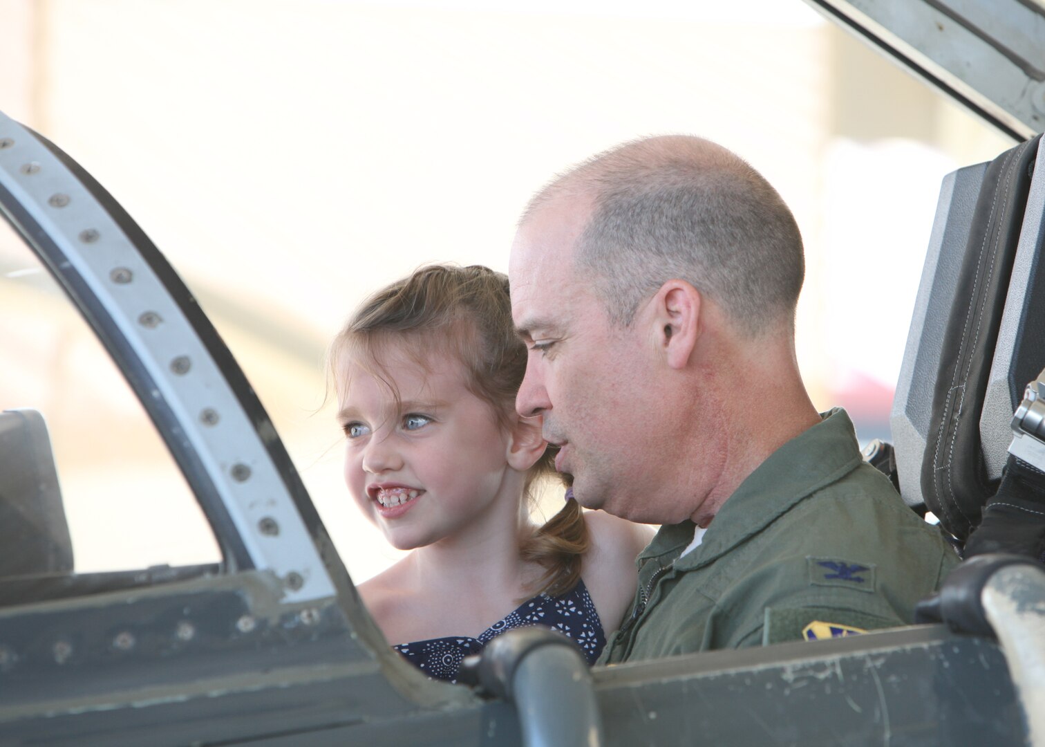 Col. David Drichta, 12th Operations Group deputy commander, shows his daughter, Natalie, the cockpit of the T-38C Talon, following his first flight back after his battle with cancer at Joint Base San Antonio-Randolph, Texas June 19, 2013.  Drichta was diagnosed with Stage IV cancer in February 2012 and, after more than a year in recovery, was medically cleared to return to flight status.  The flight marked his return to flight status as well as his 3,000th flight hour in Air Force aircraft. (Courtesy photo by Stacy Nyikos)