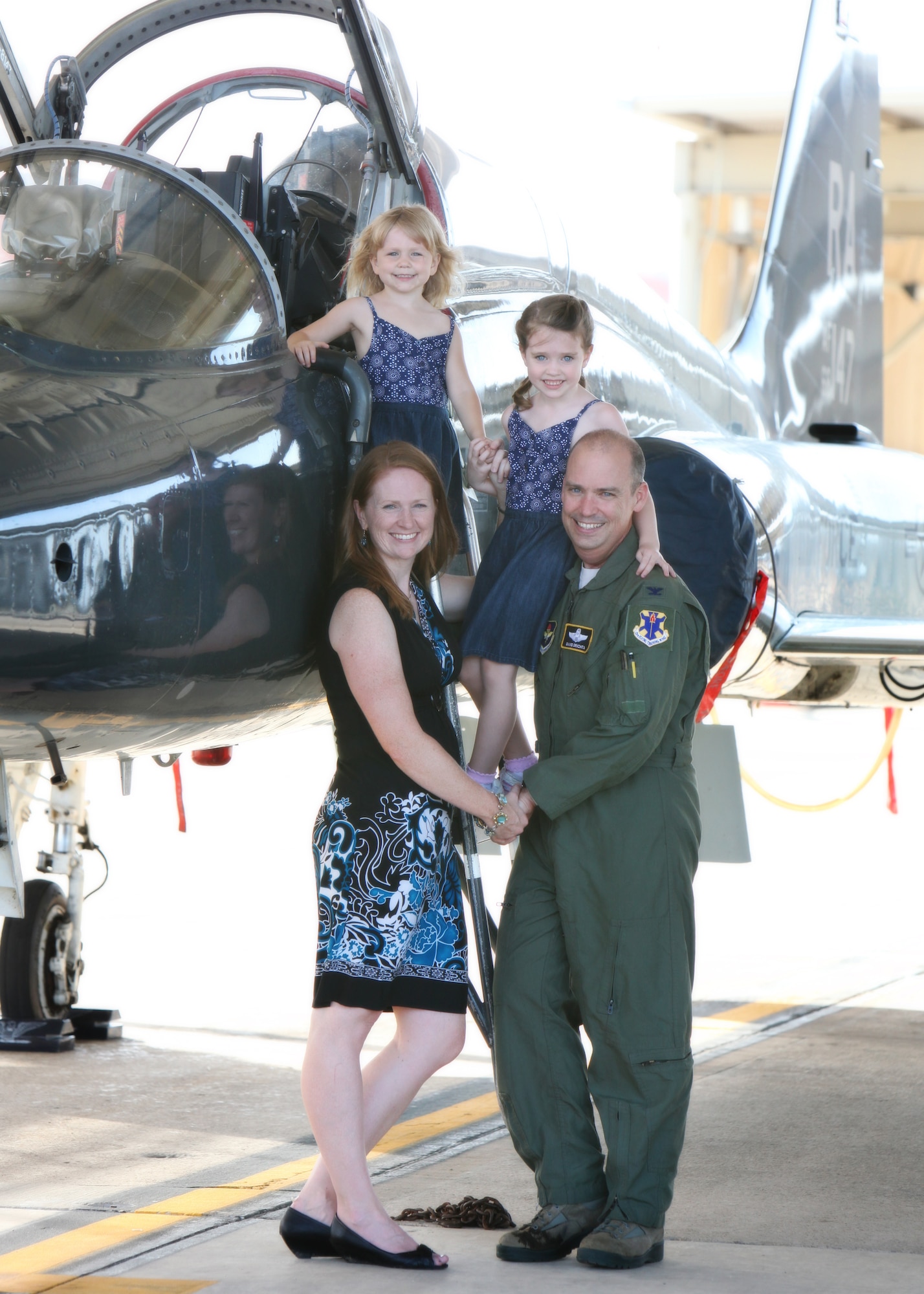 Col. David Drichta, 12th Operations Group deputy commander, his wife Shannon, and daughters, Allison and Natalie, pose for a photo with Drichta’s T-38C Talon, following his first flight back after his battle with cancer at Joint Base San Antonio-Randolph, Texas June 19, 2013.  Drichta was diagnosed with Stage IV cancer in February 2012 and, after more than a year in recovery, was medically cleared to return to flight status.  The flight marked his return to flight status as well as his 3,000th flight hour in Air Force aircraft. (Courtesy photo by Stacy Nyikos)