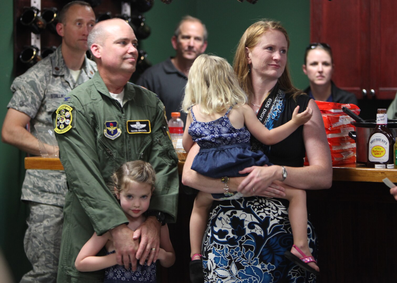 Col. David Drichta, 12th Operations Group deputy commander, his wife Shannon, and daughters, Natalie and Allison, are recognized in the 435th Fighter Training Squadron after Drichta’s first flight back after his battle with cancer at Joint Base San Antonio-Randolph, Texas June 19, 2013.  Drichta was diagnosed with Stage IV cancer in February 2012 and, after more than a year in recovery, was medically cleared to return to flight status.  The flight marked his return to flight status as well as his 3,000th flight hour in Air Force aircraft. (Courtesy photo by Stacy Nyikos)