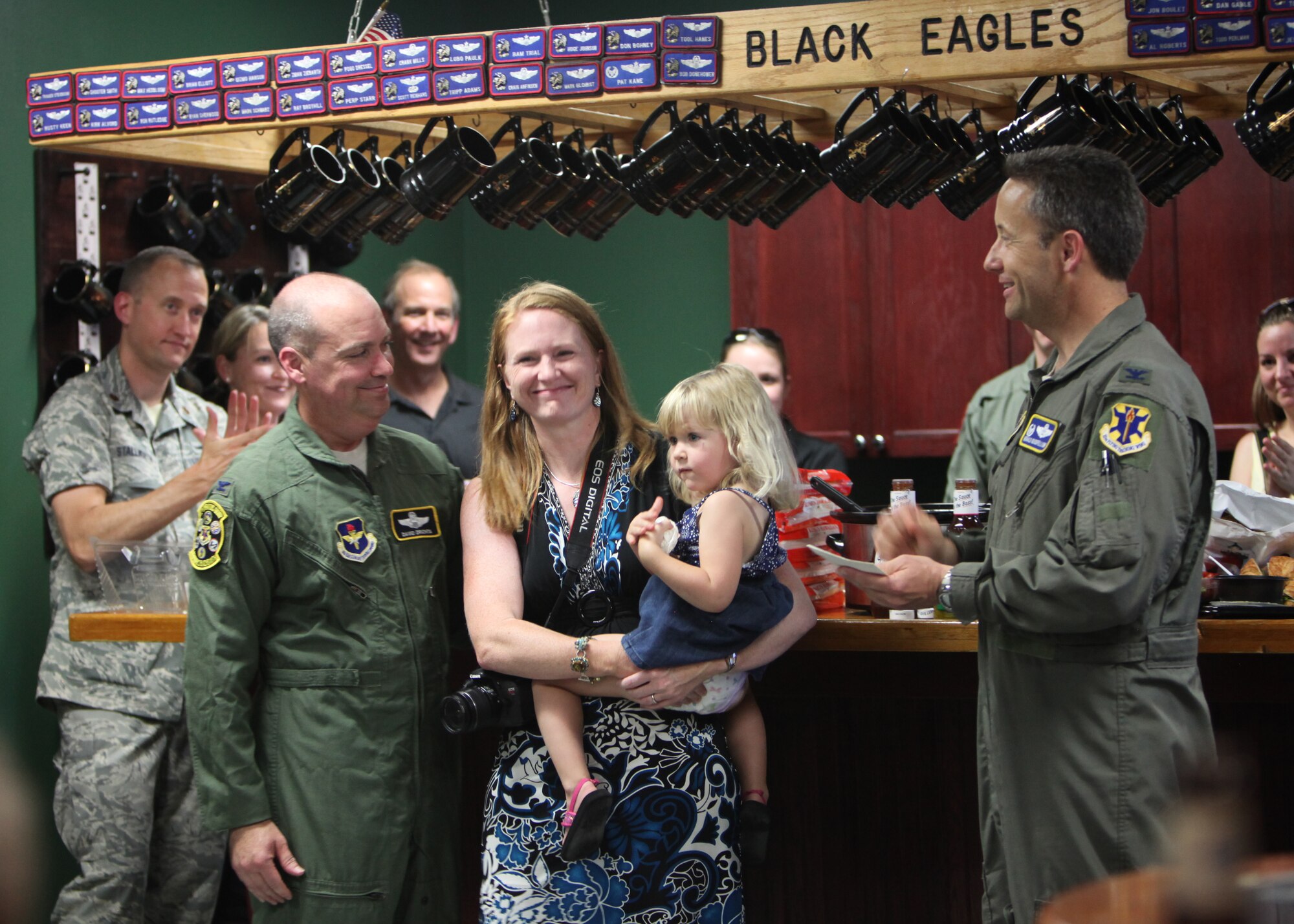 Col. Gerald Goodfellow, 12th Flying Training Wing commander, addresses Col. David Drichta, 12th Operations Group deputy commander, and his family following Drichta’s first flight back after his battle with cancer at Joint Base San Antonio-Randolph, Texas June 19, 2013.  Drichta was diagnosed with Stage IV cancer in February 2012 and, after more than a year in recovery, was medically cleared to return to flight status.  The flight marked his return to flight status as well as his 3,000th flight hour in Air Force aircraft. (Courtesy photo by Stacy Nyikos)