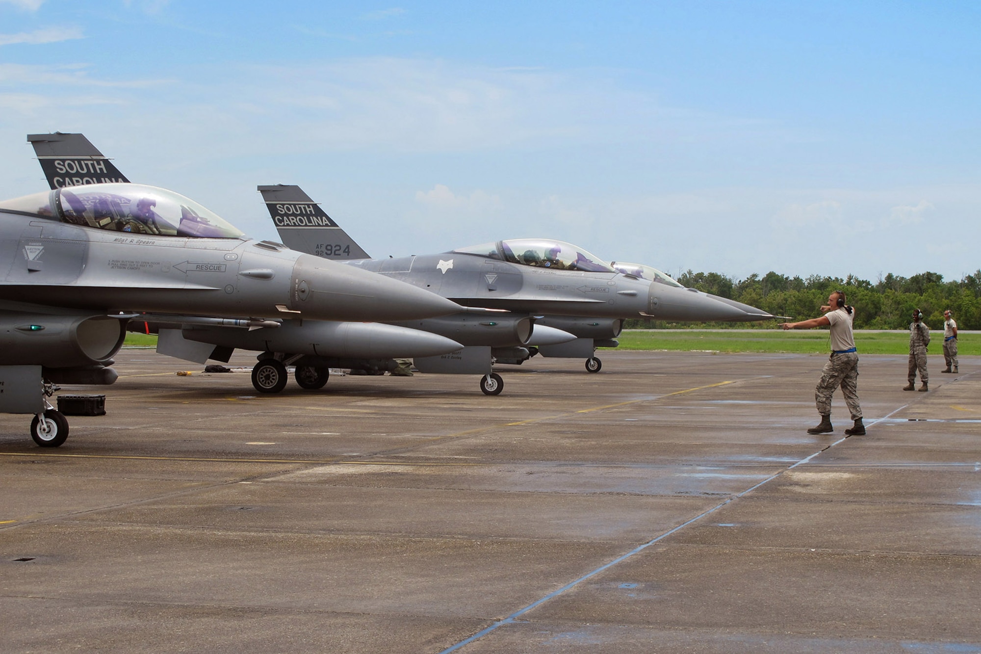 U.S. Air Force Airmen with the South Carolina Air National Guard from McEntire Joint National Guard Base, S.C., conduct flight line activities during an F-16 Fighting Falcon training mission at the Naval Air Station Joint Reserve Base New Orleans, La., June 20, 2013.   (U.S. Air National Guard photo by 157th Fighter Squadron Unit Public Affairs Representative/Released)