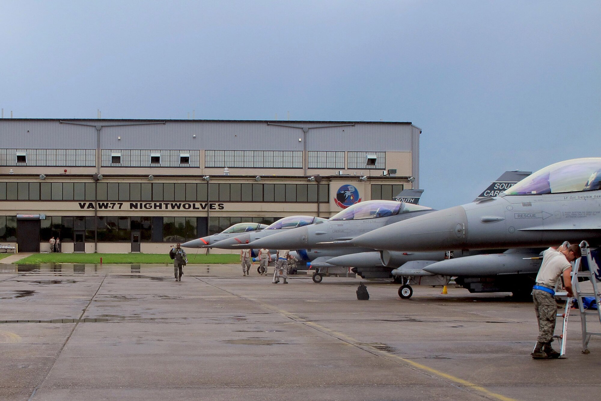 U.S. Air Force Airmen with the South Carolina Air National Guard from McEntire Joint National Guard Base, S.C., conduct flight line activities during an F-16 Fighting Falcon training mission at the Naval Air Station Joint Reserve Base New Orleans, La., June 20, 2013.   (U.S. Air National Guard photo by 157th Fighter Squadron Unit Public Affairs Representative/Released)