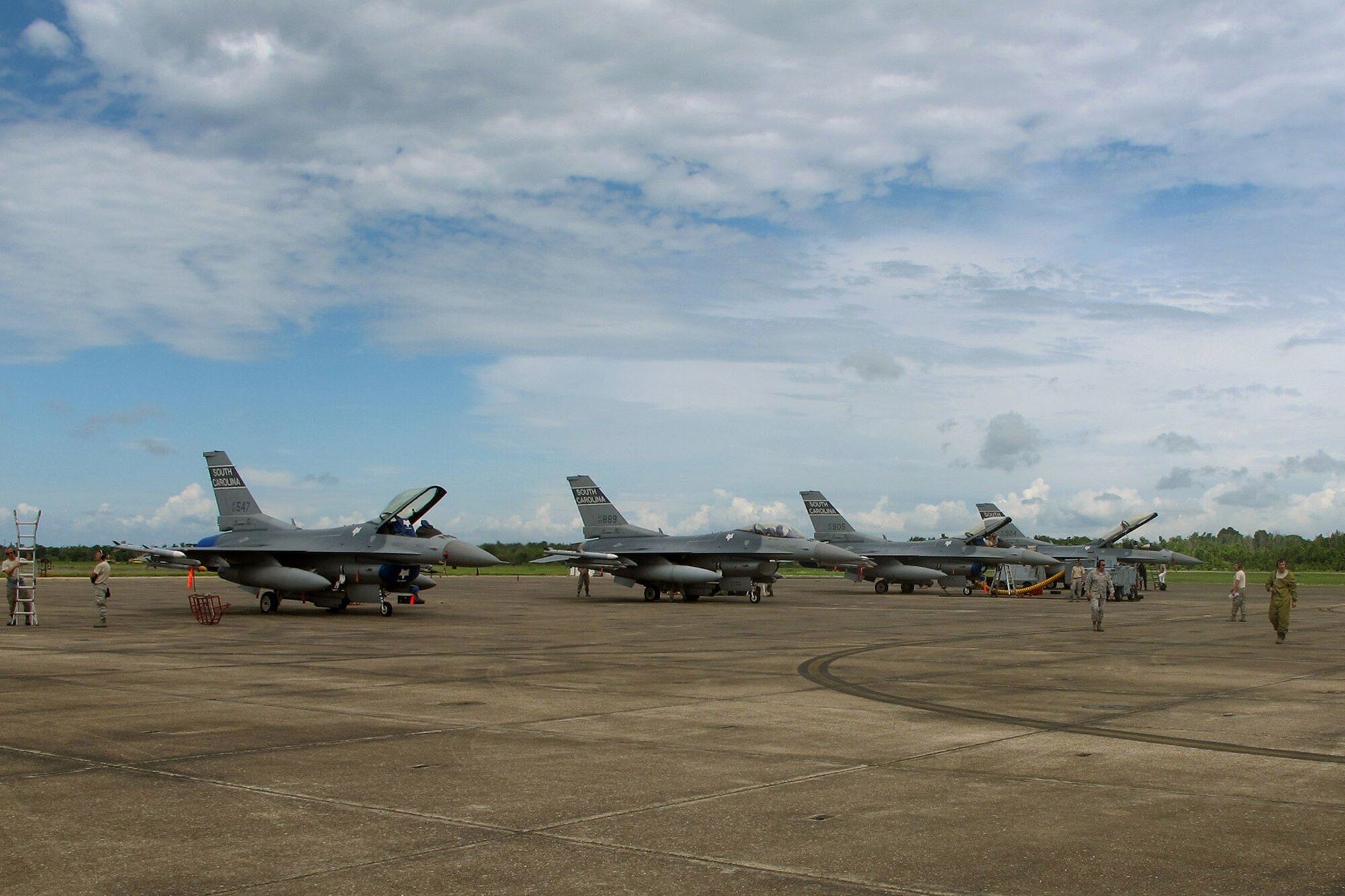 U.S. Air Force Airmen with the South Carolina Air National Guard from McEntire Joint National Guard Base, S.C., conduct flight line activities during an F-16 Fighting Falcon training mission at the Naval Air Station Joint Reserve Base New Orleans, La., June 19, 2013.   (U.S. Air National Guard photo by 157th Fighter Squadron Unit Public Affairs Representative/Released)