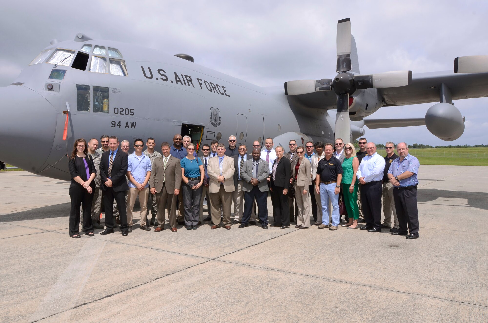 Members of various local law enforcement agencies and reservists from Dobbins Air Reserve Base, Ga., were given a tour of a C-130 Hercules prior to attending a hall dedication ceremony for former counter-terrorism AFOSI agent Jeff Fleshman June 27. Fleshman was instrumental in the OSI relocation to their current facility. (U.S. Air Force photo/Don Peek)
