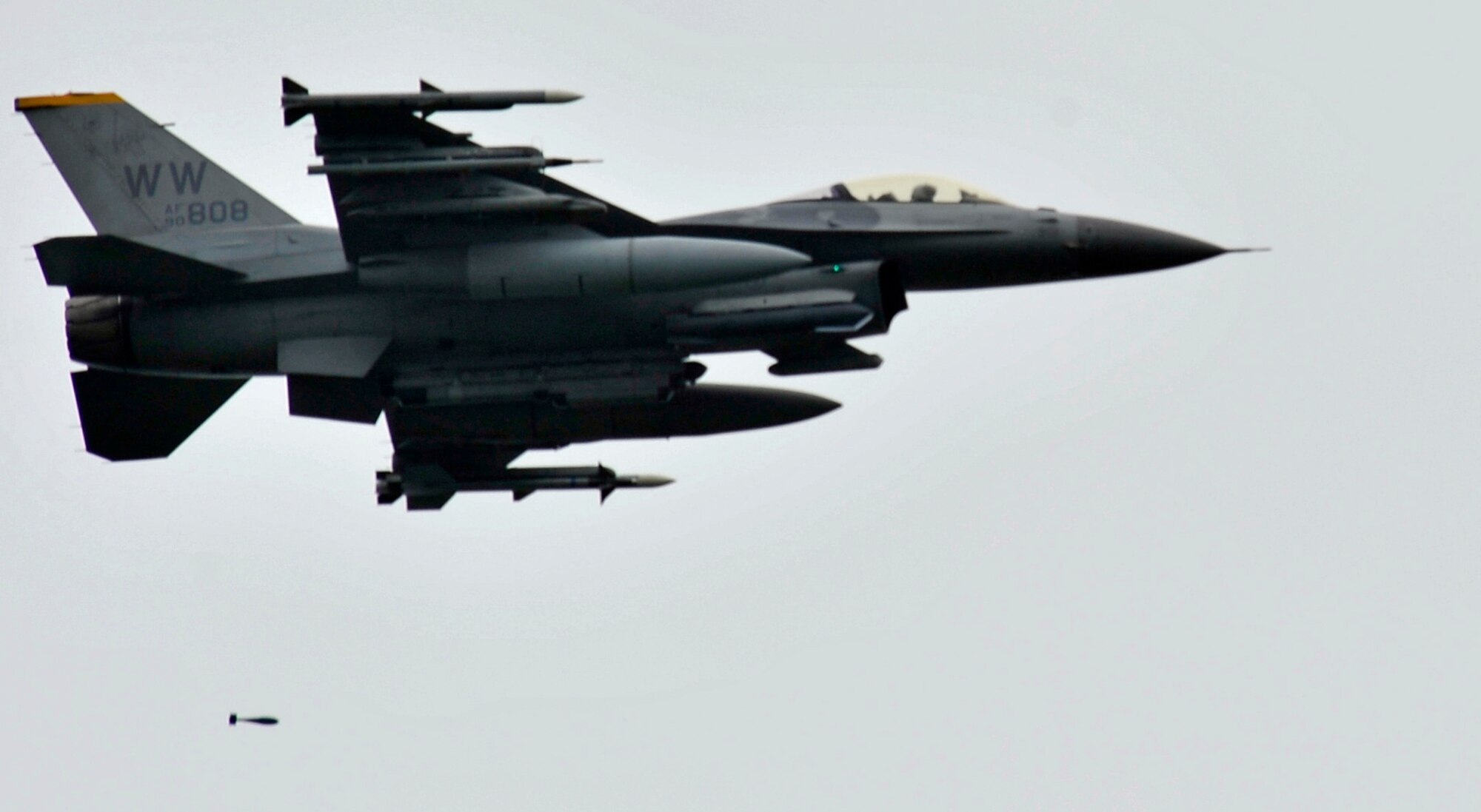 An F-16 Fighting Falcon performs a drop at Draughon Range, Japan, June 28, 2013. Throughout the day, pilots from the 13th and 14th Fighter Squadrons competed in a turkey shoot in front of members of the 35th Operations Group and their families. A turkey shoot is a competition designed to test pilots precision capabilities. (U.S. Air Force photo by Airman 1st Class Zachary Kee)