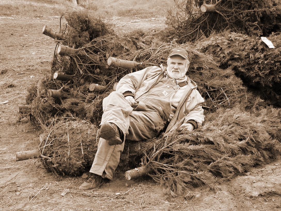 Chet Morris takes a short break during a mission to place recycled Christmas trees underwater as fish habitat near Island Park Recreation Area, Pine Flat Lake.