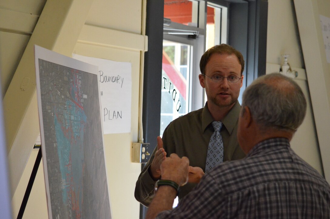 Nick Applegate (center), economics chief for the U.S. Army Corps of Engineers, speaks with members of the public during a public meeting June 12, 2013, in Reno, Nev., to outline the Corps’ proposed Truckee Meadows plan. Applegate discussed some of the potential impacts that the Corps’ proposed project could present to the local community. The Corps’ Sacramento District and our local partner, the Truckee River Flood Management Authority, hosted the public meeting to discuss and accept comments on the Corps plan to help reduce the risk of flooding along the Truckee River.