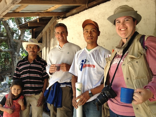 Engineers Without Borders traveled to the community of Las Vegas in the Nahuaterique region of Honduras in May 2013, to gain water rights from landowners and establish community relations.  Crystal Markley (right) is pictured with (l to r) Santos Cristobal (Treasurer of the Las Vegas Water Board) and his daughter , EWB-USA team member Rich Roberts and an unknown community team member.  