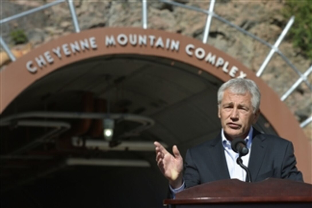 Secretary of Defense Chuck Hagel speaks to members of the press outside the entrance of Cheyenne Mountain Air Force Station on June 28, 2013.  Hagel is on a two-day visit to Cheyenne Mountain, U.S. Northern Command, and Fort Carson, where he will talk with senior leaders, service men and woman, and civilian employees assigned there.  