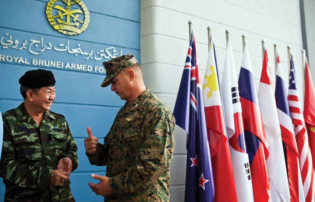 Thai Maj. Gen. Wittaya Wachirakul, left, has a conversation with U.S. Marine Col. Douglas Pasnik during the opening ceremony of the Association of Southeast Asian Nations Defence Ministers Meeting– Plus ASEAN Humanitarian Assistance/Disaster Relief and Military Medicine Exercise at the Multinational Coordination Center in Muara, Brunei, June 17. More than 2,500 multinational personnel from 18 Asia-Pacific nations participated in the exercise. Wachirakul was the commander of Royal Thai Forces during the exercise. Pasnik is the director of regional operations for U.S. Marine Corps Forces, Pacific. 