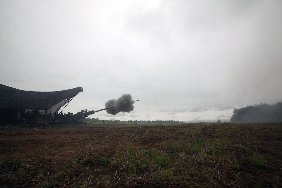 Marines with 3rd Battalion, 12th Marine Regiment, fire a 155 mm high-explosive round June 17 at the Yausubetsu Maneuver Area, Hokkaido, Japan, as part of the Artillery Relocation Training Program 13-1. 3rd Bn., 12th Marines, is part of 3rd Marine Division, III Marine Expeditionary Force. 