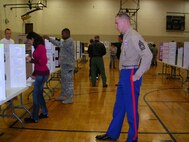 Volunteers from the North American Aerospace Defense Command and the U.S. Northern Command judge entries at the 2nd Annual Mitchell High School Science Fair Competition. NORAD and USNORTHCOM participates with Mitchell High School in a partnership educational program to aid in the overall educational experience for the students of District 11.