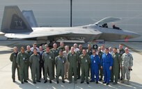 North American Air Chiefs Conference attendees pose in front of an F-22 Raptor from the 43rd Fighter Squadron at Tyndall AFB, Fla., where military and civilian officials from Mexico, Canada and cross the United States met to discuss mutual homeland security operations.