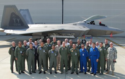 North American Air Chiefs Conference attendees pose in front of an F-22 Raptor from the 43rd Fighter Squadron at Tyndall AFB, Fla., where military and civilian officials from Mexico, Canada and cross the United States met to discuss mutual homeland security operations.
