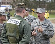 Air Force Gen. Victor E. Renuart Jr., commander of the North American Aerospace Defense Command (NORAD), talks to a Naval Operations Sailor during Vibrant Response, a federal emergency response exercise conducted at Muscatatuck Urban Training Center on November 9, 2009. 