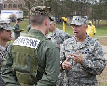 Air Force Gen. Victor E. Renuart Jr., commander of the North American Aerospace Defense Command (NORAD), talks to a Naval Operations Sailor during Vibrant Response, a federal emergency response exercise conducted at Muscatatuck Urban Training Center on November 9, 2009. 