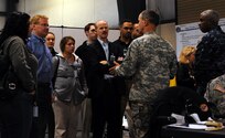 Maj.Gen. Daniel E. Long Jr., the Joint Task Force Civil Support commanding general, speaks with a group of congressional staff in the Operations Center for the Chemical, Biological, Radiological, Nuclear and high-yield Explosive Consequence Management Response Force’s (CCMRF) field training exercise VIBRANT RESPONSE at the Camp Atterbury, Indiana training site on Monday (Nov. 9, 2009). The staffers were provided information on how U.S. Northern Command’s CCMRF would work with other federal, state, National Guard and local emergency responders during an actual event, and the role of JTF-CS in directing the efforts of the CCMRF in a whole of government response.
