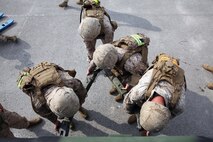 Marines with Transportation and Support Company, Combat Logistics Battalion 2, 2nd Marine Logistics Group attach a tow bar to a medium tactical vehicle replacement during one of the six obstacles during a fire team challenge aboard Camp Lejeune, N.C., June 27, 2013. Service members with T&S Co. were evaluated while assembling and disassembling machine guns, performing a casualty assessment and treatment, and answering a 30 question Marine Corps knowledge test.