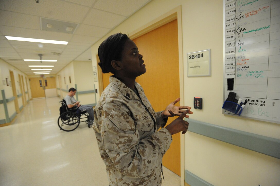Staff Sgt. Royneka Hood, Marine Liaison, checks where her Marines and sailors are at Hunter Holmes McGuire VA Medical Center on June 30, 2013. Hood is the military liaison for all Marines and sailors at the Hunter Holmes medical center.