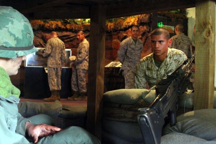Recruit Marcos Bocanegra, Platoon 3225, Company K, 3rd Recruit Training Battalion, looks at a  Vietnam War exhibit during a trip to the museum aboard Marine Corps Recruit Depot San Diego June 12.  