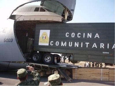 Mexican Army field kitchen gets loaded onto a U.S. Air Force C-5 at Santa Lucia Air Base, Mex., Feb. 6.