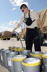 Staff Sgt. Roberto Caceres, decontamination noncommissioned officer, 92nd Civil Support Team, Nevada National Guard, prepares a decontamination site during the 92nd CST’s evaluation exercise Feb. 10 at the National Guard Readiness Center in Las Vegas.

