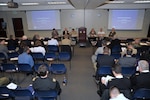 Attendees at the NORAD and USNORTHCOM Maritime Stakeholders Conference participate in a panel discussion on information sharing March 31. Nearly 250 people from the U.S. and Canadian navies as well as civilian maritime agencies participated in the conference, which consisted of presentations, panel discussions and tabletop exercises.

