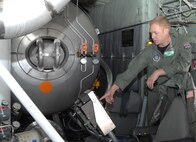 Air Force Master Sgt. Lamont Wood, 731st Airlift Squadron loadmaster, points out the control system for the Modular Airborne Firefighting System to members of the media after a successful test of the system April 22. The MAFFS II system was tested in preparation for a week-long certification event in which the 302nd Airlift Wing will participate in Greenville, S.C., April 26. 