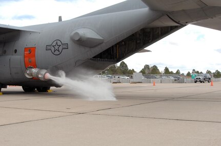 Members of the 302nd Airlift Wing begin a wet fire test of the Modular Airborne Firefighting System II April 22. Air crew members test the system using water, but when operational, firefighters have several different types of fire retardant at their disposal. Carried in the cargo area of a C-130, the MAFFS II is capable of dispersing fire retardant in a quarter-mile long, 100 ft. wide swath from 150 feet in the air, creating fire breaks to protect communities in the path of forest fires. During periods of high wildfire activity, MAFFS-trained military units such as the 302nd, are available under command of U.S. Northern Command to supplement other fire-fighting aircraft. 