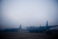 U.S. Air Force C-130 aerial spray aircraft from the 910th Airlift Wing at Youngstown-Warren Air Reserve Station, Ohio, wait for a weather hold to be lifted at Stennis International Airport in Kiln, Miss. May 4, 2010. Members of the 910th Airlift Wing (AW) are in Mississippi to assist with the Deepwater Horizon oil spill. The 910th AW specializes in aerial spray and is the Department of Defense?s only large-area fixed-wing aerial spray unit. 