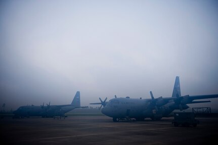 U.S. Air Force C-130 aerial spray aircraft from the 910th Airlift Wing at Youngstown-Warren Air Reserve Station, Ohio, wait for a weather hold to be lifted at Stennis International Airport in Kiln, Miss. May 4, 2010. Members of the 910th Airlift Wing (AW) are in Mississippi to assist with the Deepwater Horizon oil spill. The 910th AW specializes in aerial spray and is the Department of Defense?s only large-area fixed-wing aerial spray unit. 