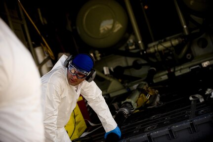 U.S. Air Force Staff Sgt. Jeremy Rogers an aerial spray aircraft maintainerfrom the 910th Aircraft Maintenance Squadron  at Youngstown-Warren Air Reserve Station, Ohio, refills a chemical dispersing C-130 Hercules aircraft at Stennis International Airport in Kiln, Miss., May 4, 2010. Members of the 910th Airlift Wing (AW) are in Mississippi to assist with the Deepwater Horizon oil spill. The 910th AW specializes in aerial spray and is the Department of Defense's only large-area fixed-wing aerial spray unit. 